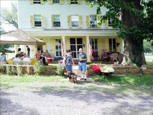 photo of people at  Penrose Strawbridge House at our 2013 Summer Corn Boil