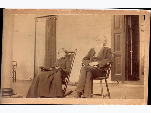photo of Abel and Sara Penrose c1875-1893? on rocking chairs on porch