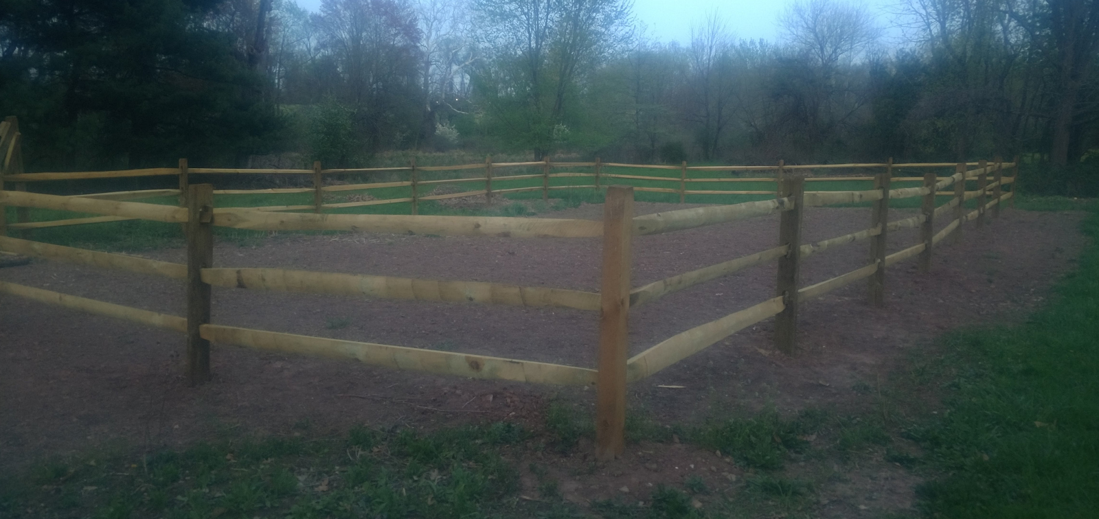 photo of split rail fence around empty garden