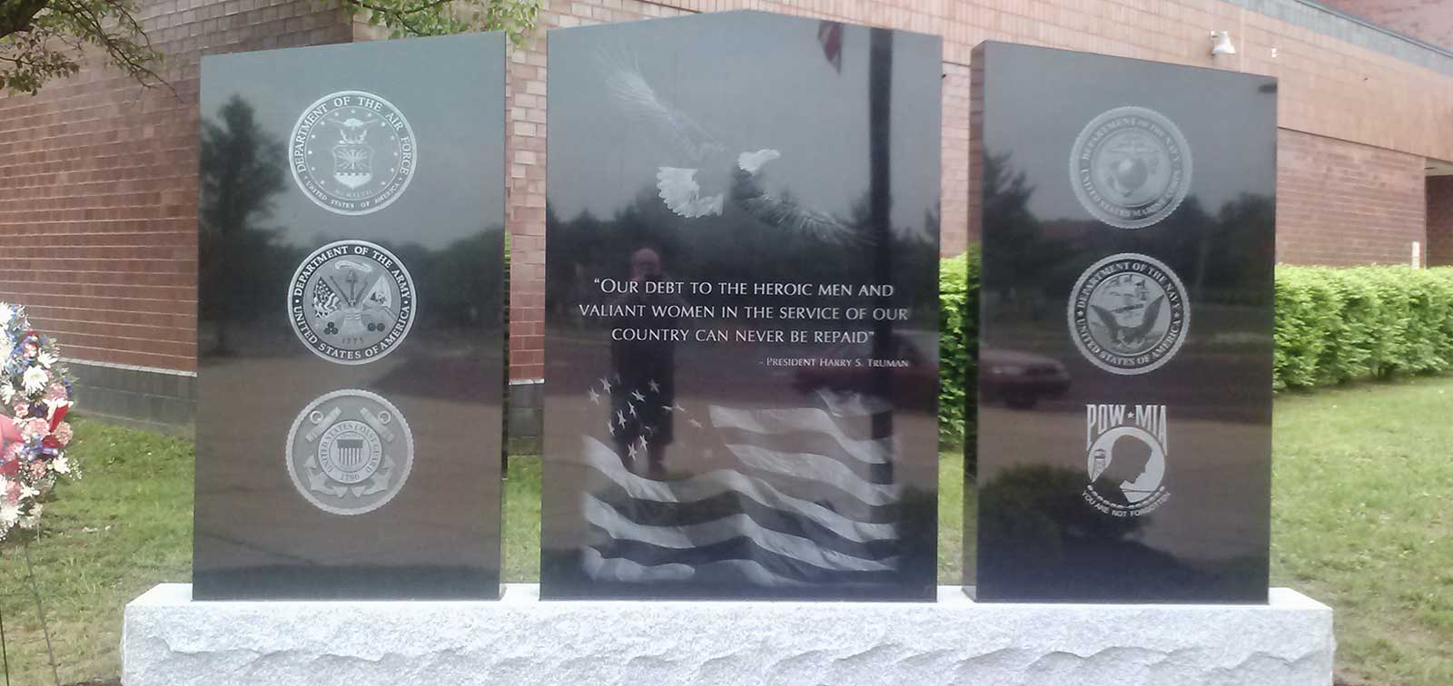 photo of black granite Hatboro Horsham War Memorial in front of Hatboro Horsham High School