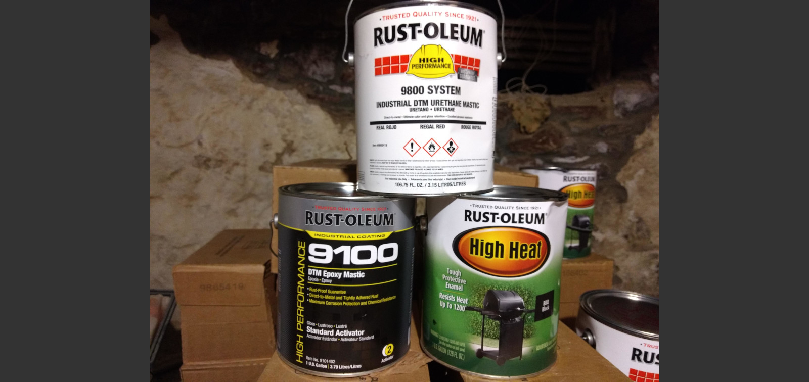 3 gallon cans of Rustoleum paint stacked