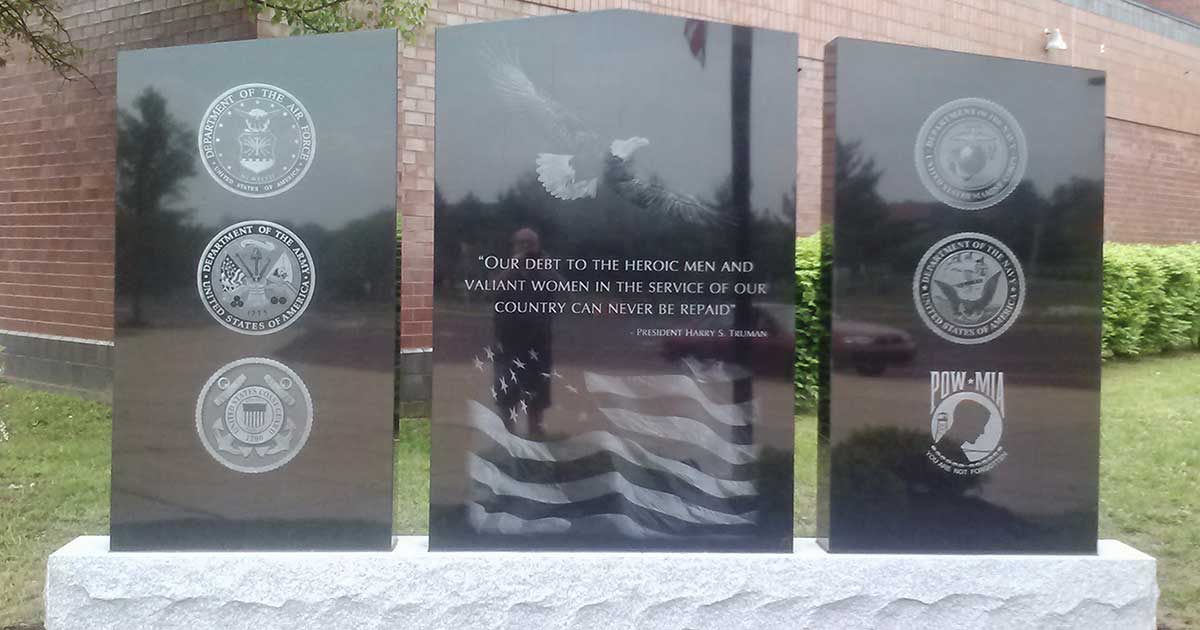 photo of black granite Hatboro Horsham War Memorial in front of Hatboro Horsham High School